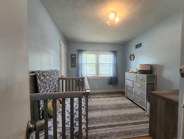 bedroom with visible vents and baseboards
