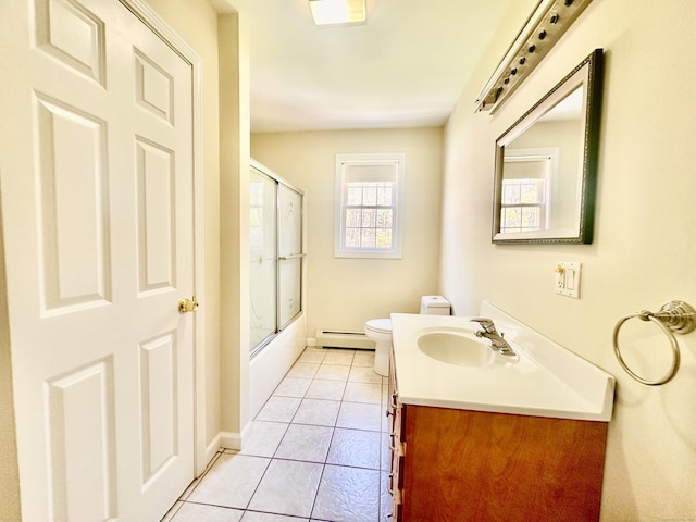 bathroom with vanity, toilet, tile patterned floors, baseboards, and a baseboard heating unit