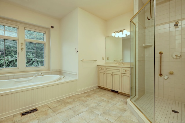395 Isinglass Rd, Shelton, CT 06484 - bathroom featuring vanity, tile patterned flooring, a bath, a stall shower, and baseboards