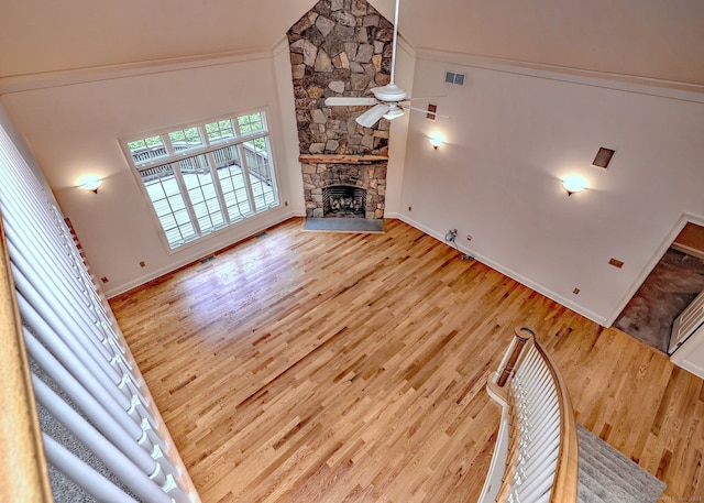 395 Isinglass Rd, Shelton, CT 06484 - unfurnished living room featuring a ceiling fan, wood finished floors, baseboards, a fireplace, and crown molding