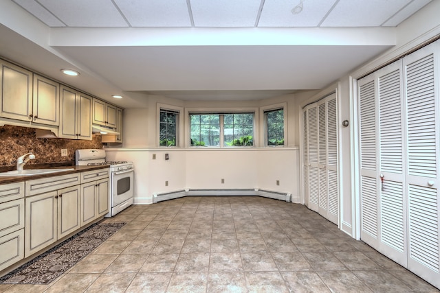 395 Isinglass Rd, Shelton, CT 06484 - kitchen with white range with gas cooktop, a sink, under cabinet range hood, baseboard heating, and backsplash