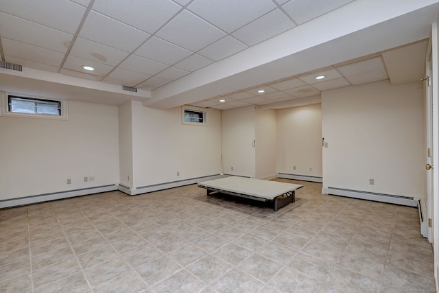 395 Isinglass Rd, Shelton, CT 06484 - basement featuring a paneled ceiling, baseboard heating, and recessed lighting