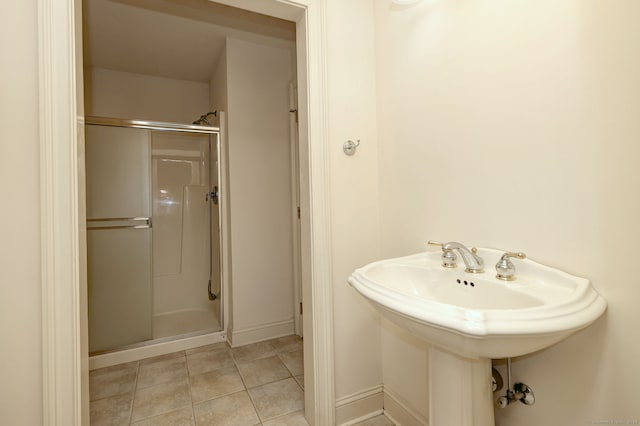395 Isinglass Rd, Shelton, CT 06484 - full bath featuring a stall shower, tile patterned floors, baseboards, and a sink