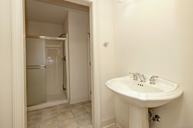 395 Isinglass Rd, Shelton, CT 06484 - full bath with a stall shower, tile patterned flooring, baseboards, and a sink