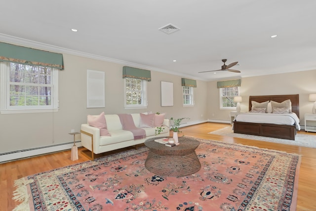 bedroom featuring crown molding, visible vents, a baseboard heating unit, recessed lighting, and wood finished floors