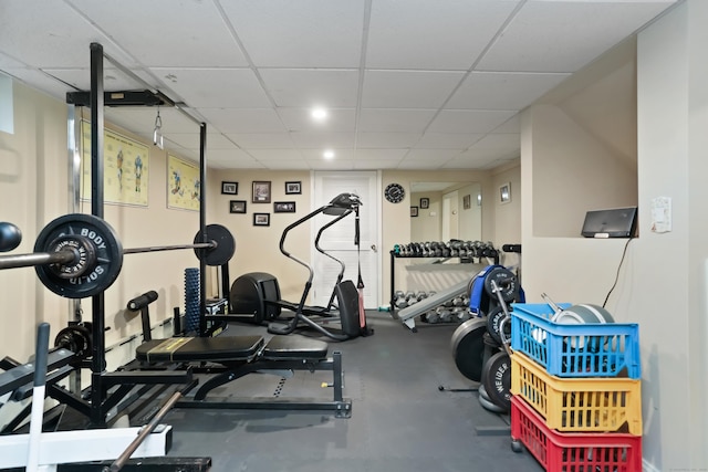 workout area featuring a paneled ceiling