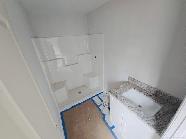 full bathroom featuring vanity and a shower