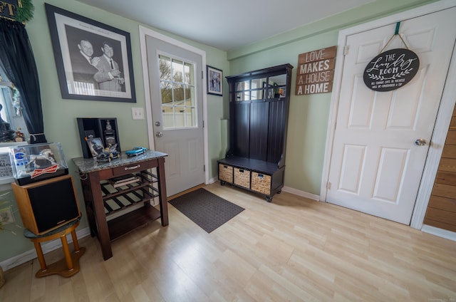 mudroom with baseboards and light wood-style flooring