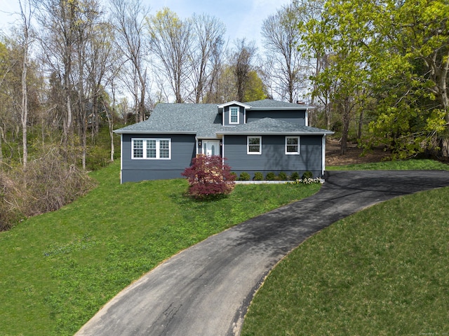 19 Stony Brook Rd, Brookfield, CT 06804 - view of front of house with aphalt driveway, a front lawn, and roof with shingles
