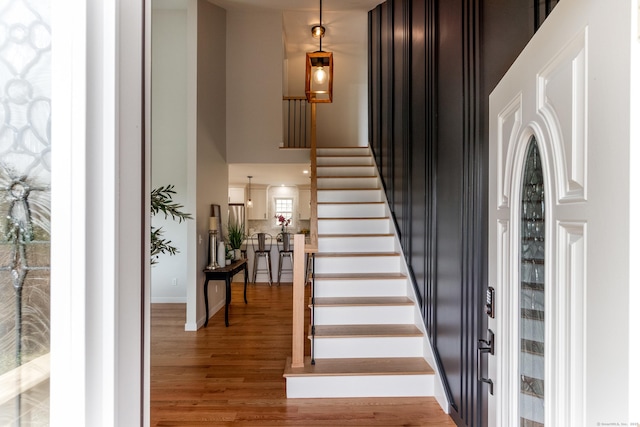 19 Stony Brook Rd, Brookfield, CT 06804 - staircase featuring a towering ceiling and wood finished floors