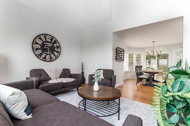 19 Stony Brook Rd, Brookfield, CT 06804 - living area with an inviting chandelier, light wood-style flooring, and baseboards
