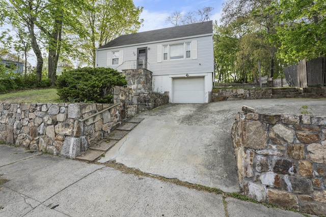 view of front of property featuring an attached garage and driveway