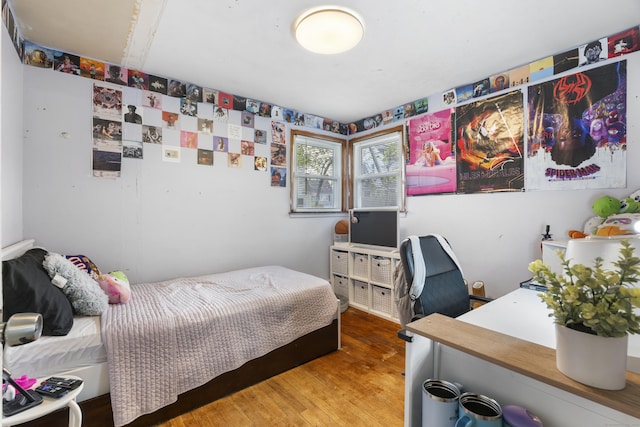 bedroom with wood finished floors
