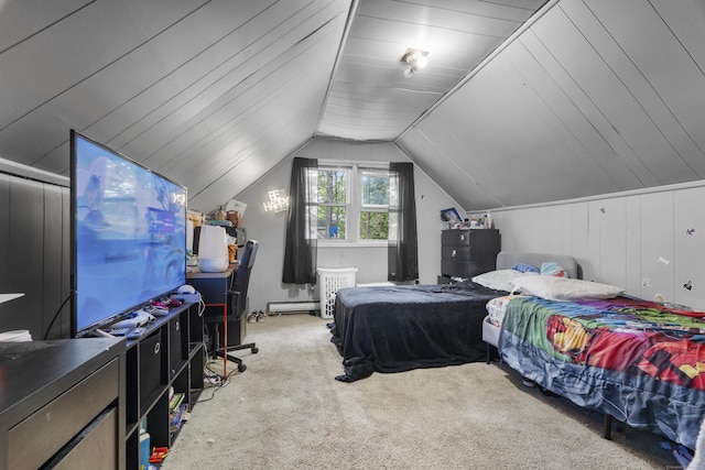 carpeted bedroom featuring a baseboard heating unit and vaulted ceiling