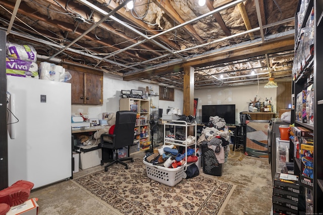unfinished below grade area with freestanding refrigerator