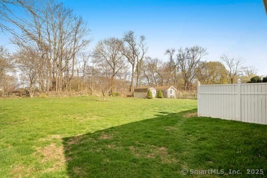127 Pleasant View Rd, Derby, CT 06418 - view of yard featuring an outdoor structure, fence, and a storage unit