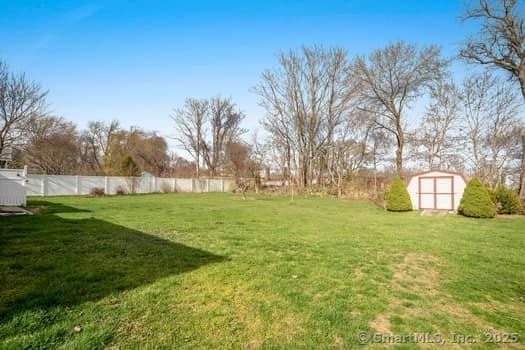 127 Pleasant View Rd, Derby, CT 06418 - view of yard featuring fence, an outbuilding, and a shed