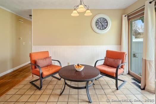 127 Pleasant View Rd, Derby, CT 06418 - sitting room featuring a wainscoted wall and a chandelier