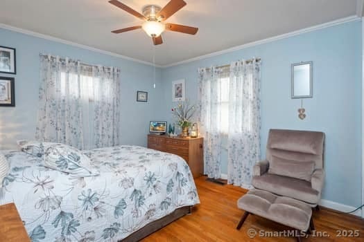 127 Pleasant View Rd, Derby, CT 06418 - bedroom with crown molding, wood finished floors, and multiple windows