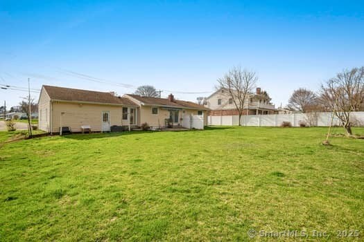 127 Pleasant View Rd, Derby, CT 06418 - back of house featuring fence and a yard