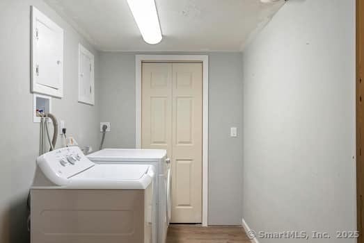 127 Pleasant View Rd, Derby, CT 06418 - laundry area featuring washing machine and clothes dryer, baseboards, light wood finished floors, and laundry area