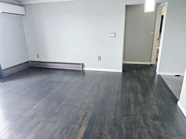 184 Pequot Ave Unit 406, New London, CT 06320 - spare room featuring a baseboard heating unit, baseboards, wood finished floors, and a wall mounted AC