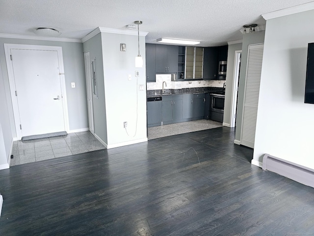 184 Pequot Ave Unit 406, New London, CT 06320 - kitchen featuring stainless steel appliances, baseboards, dark countertops, and crown molding