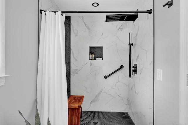 full bath featuring a marble finish shower