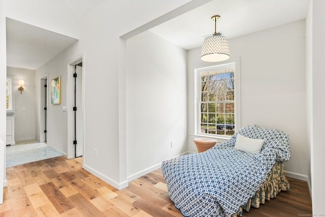 sitting room with light wood-style flooring and baseboards