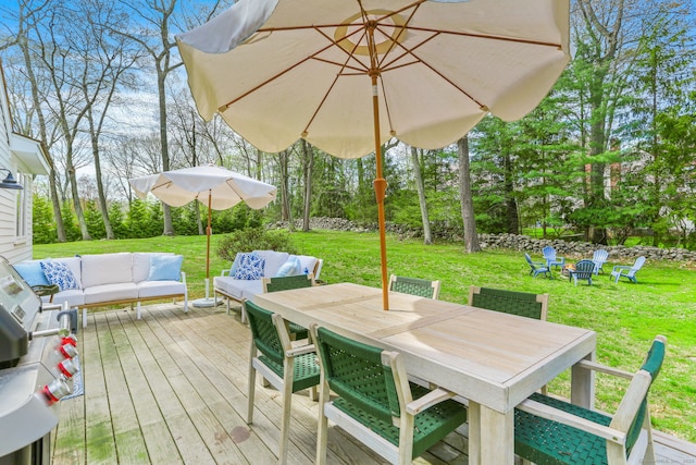 wooden deck featuring a grill, a lawn, outdoor lounge area, and outdoor dining space