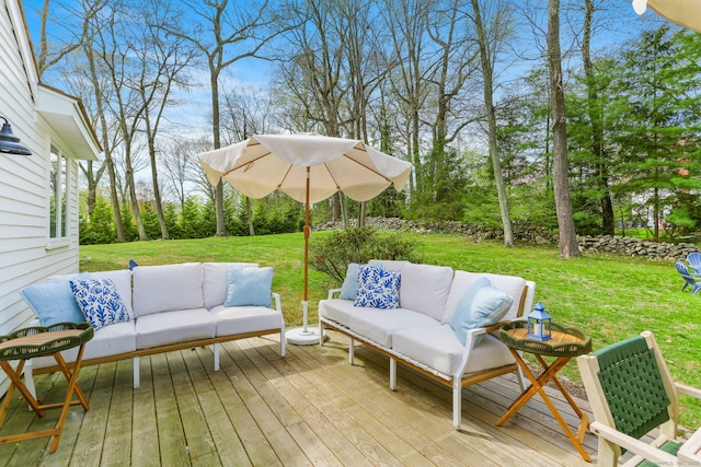 deck featuring a yard and an outdoor hangout area
