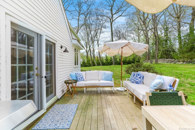 deck featuring a lawn and an outdoor living space