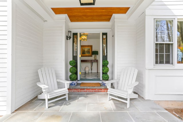 view of exterior entry featuring a porch