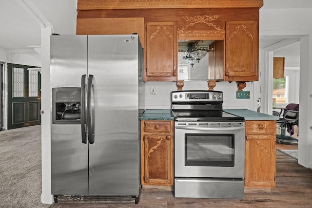 260 Robin St, Bridgeport, CT 06606 - kitchen with appliances with stainless steel finishes, brown cabinets, and dark wood-type flooring