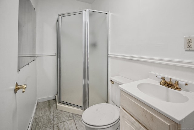 260 Robin St, Bridgeport, CT 06606 - bathroom with a stall shower, marble look tile flooring, toilet, vanity, and baseboards