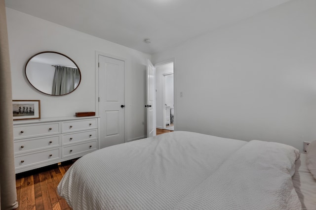 bedroom with wood finished floors