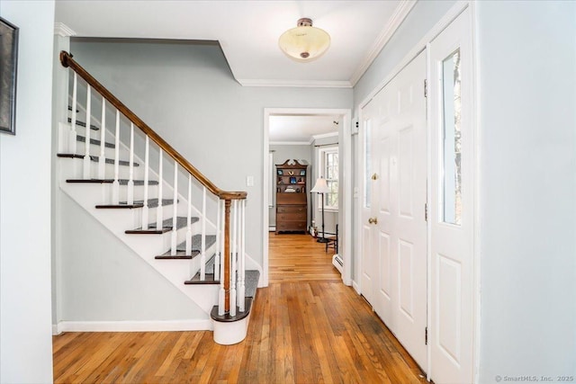 19 Fairchild Rd, Newtown, CT 06470 - entrance foyer with hardwood / wood-style flooring, stairway, and crown molding