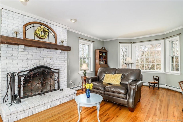 19 Fairchild Rd, Newtown, CT 06470 - living room featuring a baseboard radiator, crown molding, wood-type flooring, baseboards, and a brick fireplace