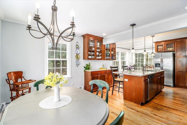 19 Fairchild Rd, Newtown, CT 06470 - dining space with a chandelier, light wood finished floors, crown molding, and recessed lighting