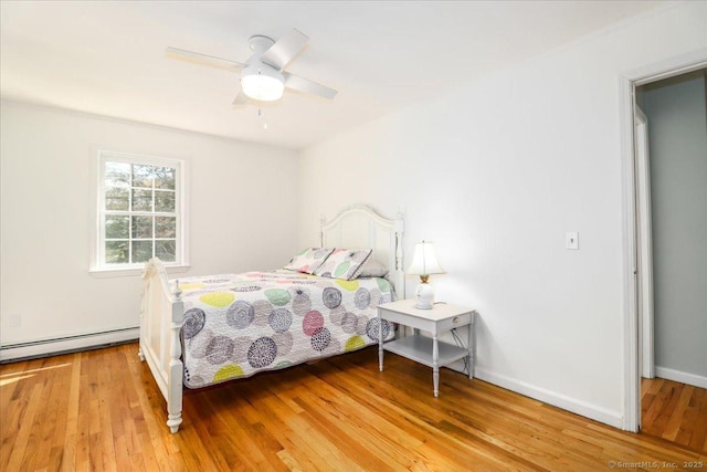 19 Fairchild Rd, Newtown, CT 06470 - bedroom featuring wood finished floors, a ceiling fan, and baseboard heating