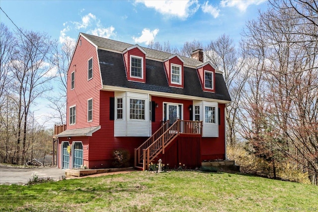 19 Fairchild Rd, Newtown, CT 06470 - colonial inspired home with a gambrel roof, a chimney, roof with shingles, and a front yard