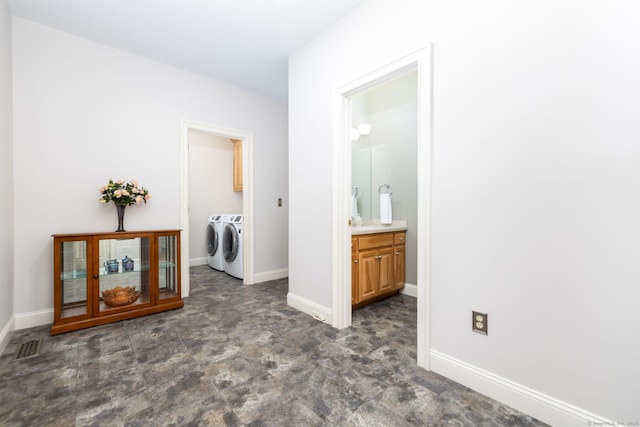 176 Fox Hollow Ln, Bristol, CT 06010 - hall with washing machine and dryer and baseboards