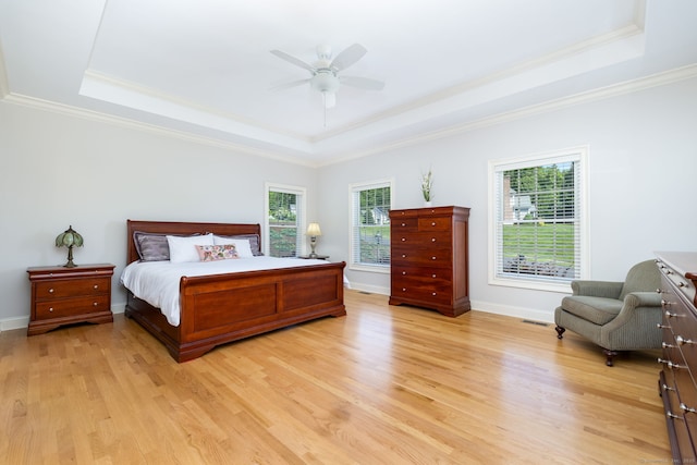 176 Fox Hollow Ln, Bristol, CT 06010 - bedroom with a tray ceiling, ornamental molding, light wood finished floors, baseboards, and ceiling fan