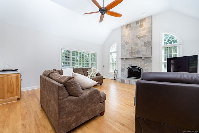 176 Fox Hollow Ln, Bristol, CT 06010 - living room featuring lofted ceiling, ceiling fan, light wood finished floors, a fireplace, and baseboards