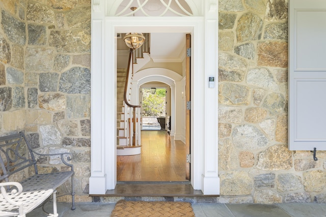 doorway to property with stone siding