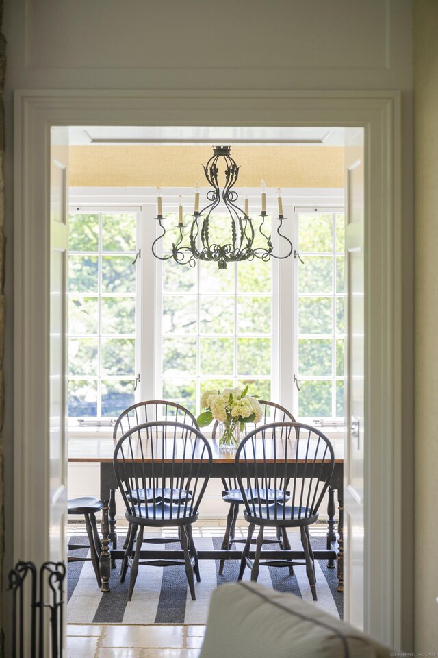 dining space featuring a chandelier and plenty of natural light