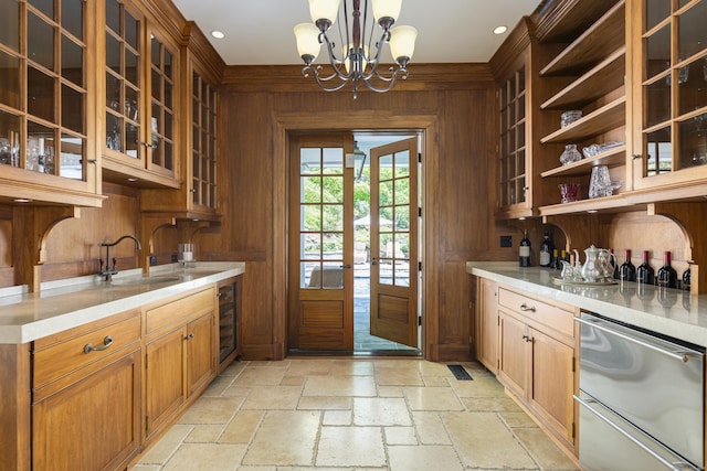 kitchen with a sink, light countertops, beverage cooler, open shelves, and wooden walls