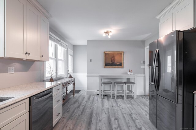 211 Crest St, Waterbury, CT 06708 - kitchen featuring black refrigerator with ice dispenser, dishwasher, white cabinets, and light wood-type flooring