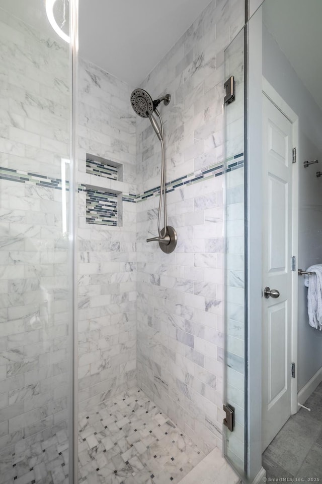 bathroom with a shower stall