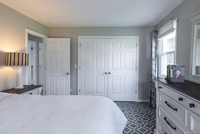 bedroom featuring a closet and baseboards